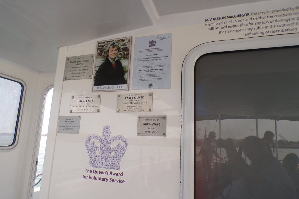 Boat interior displaying community service awards.