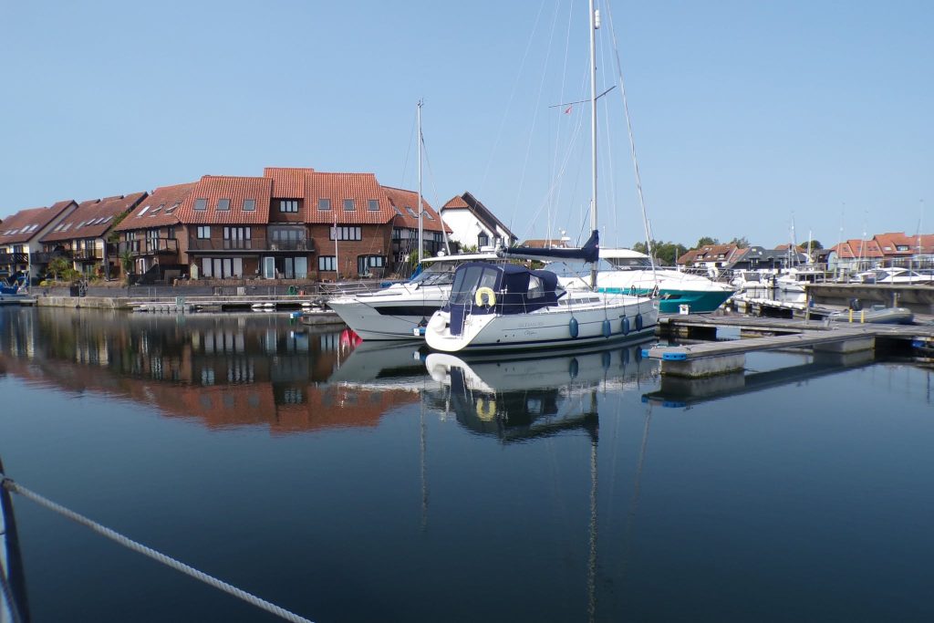 Yacht moored at a peaceful marina.